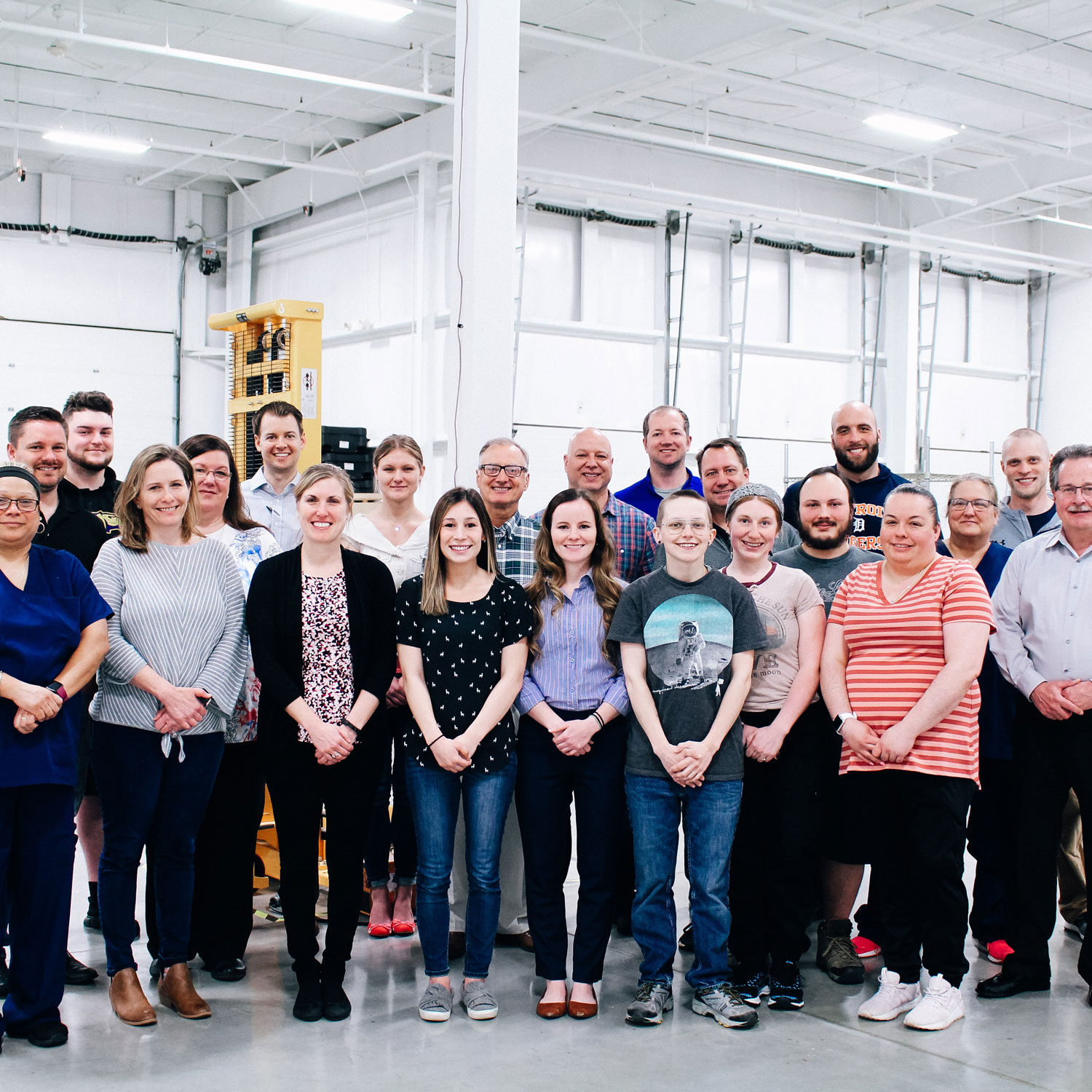 A photo of the MediSurge team posed in the lab, their arms crossed in front.