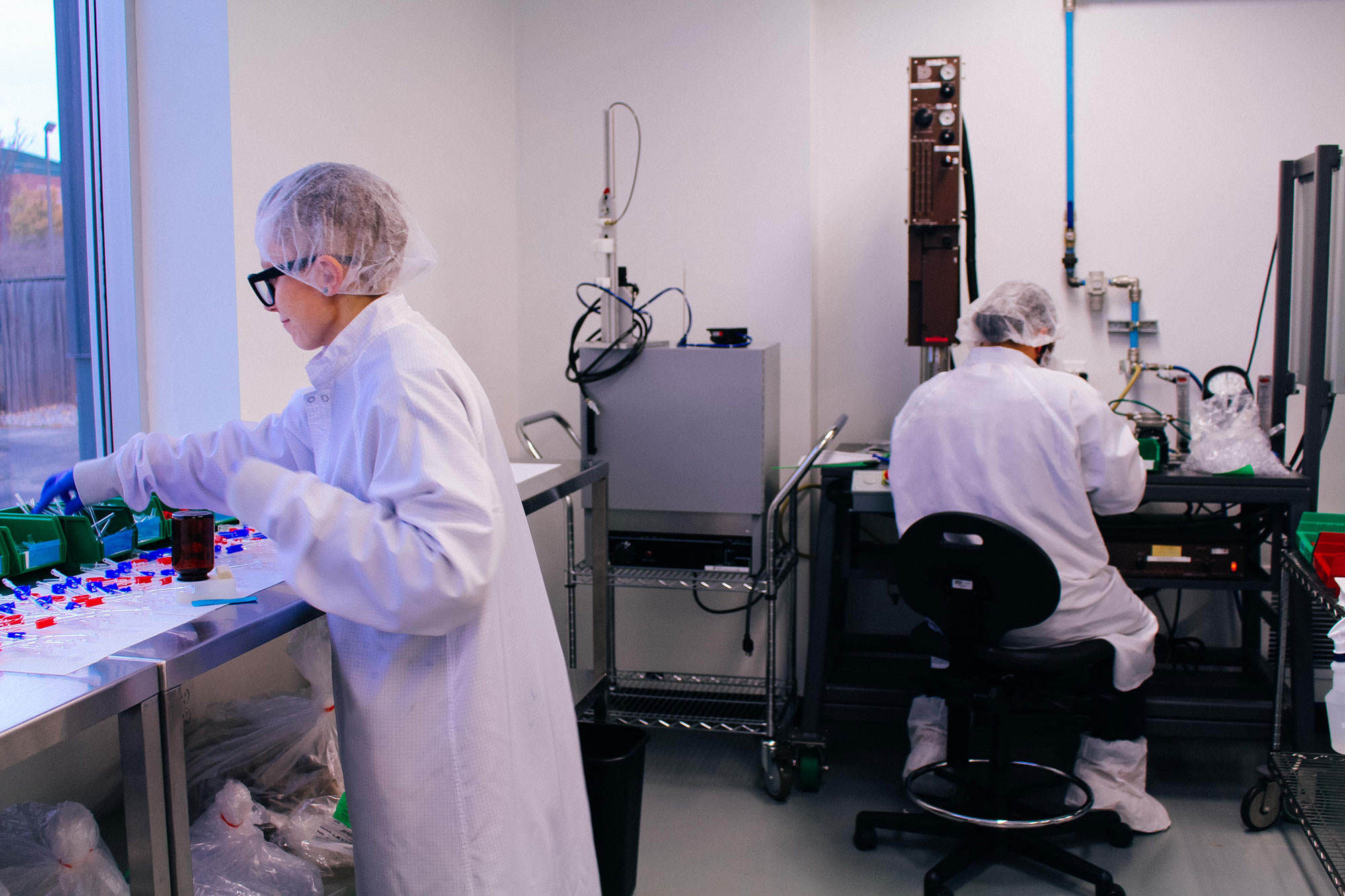 An image of lab workers closing out their day in the iso class 7 cleanroom.